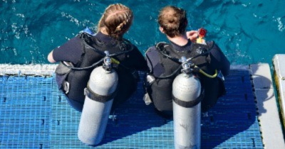 BCDs on two scuba divers