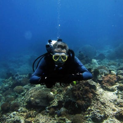 Woman diving with cool scuba accessories