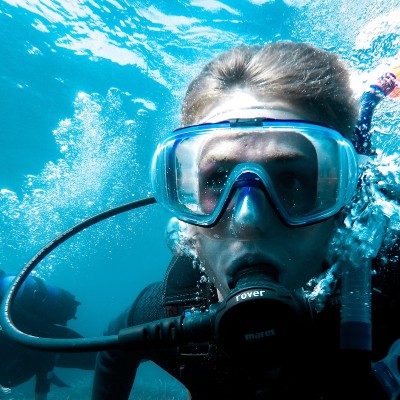 diver with regulator in her mouth