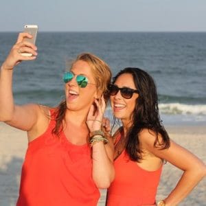 Women traveling and using a mobile hotspot for their cell phone