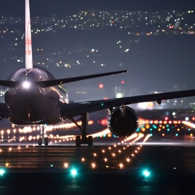 Airplane about to take off at night on runway