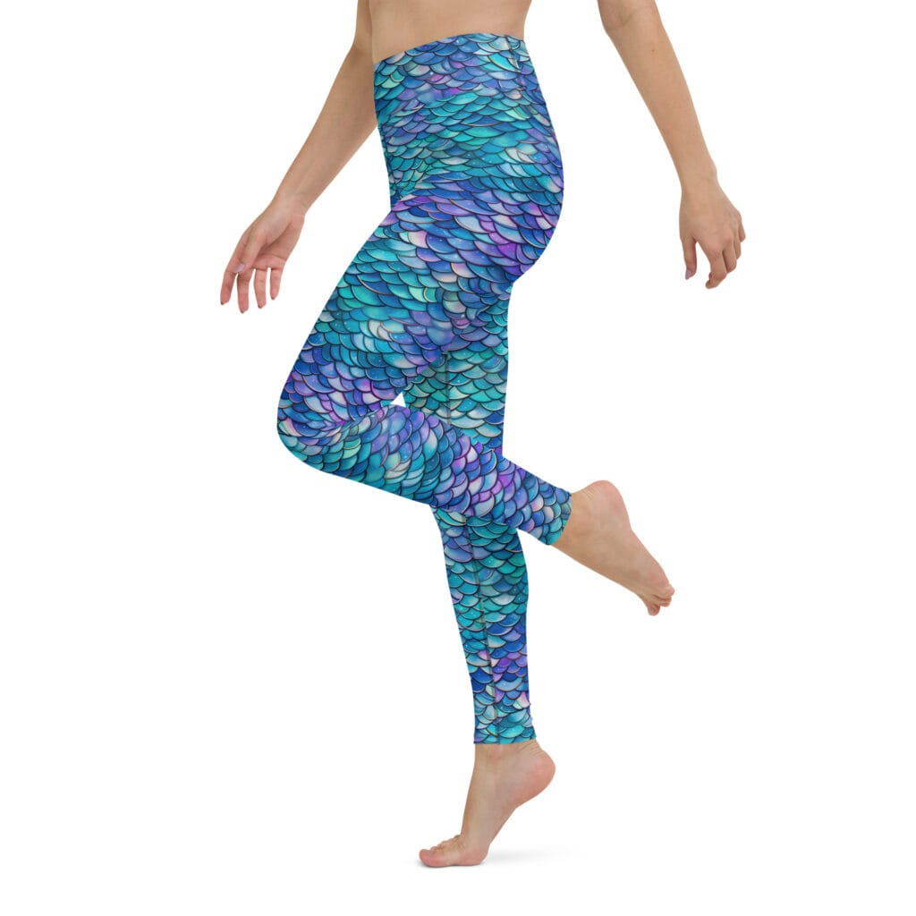 Blue mermaid print leggings on a model who is posing.