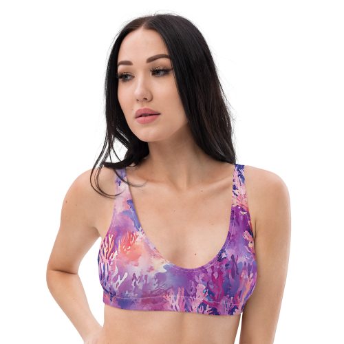 Model wearing "Whispers of the Reef" print bikini top, made from recycled fabrics.