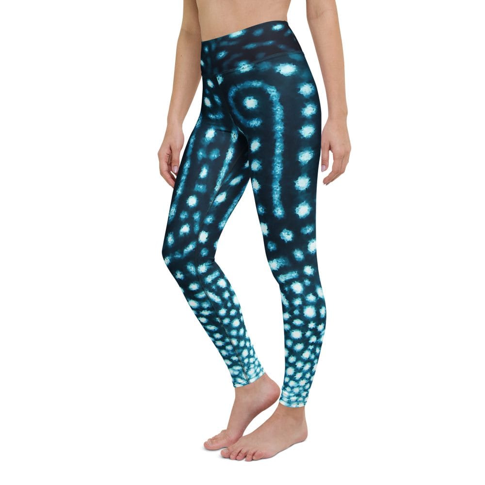 Model posing to show the side of Whale Shark Wanderer leggings from Scuba Girl Gear.