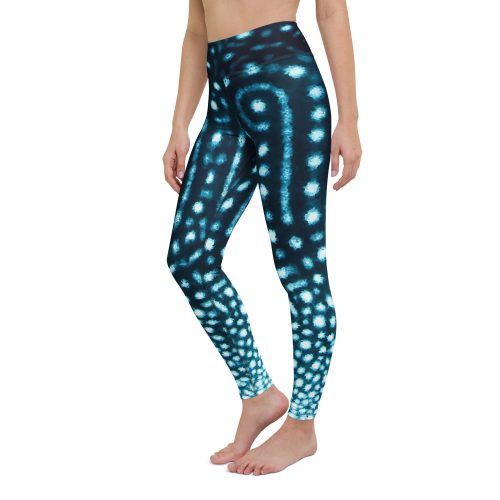 Model posing to show the side of Whale Shark Wanderer leggings from Scuba Girl Gear.