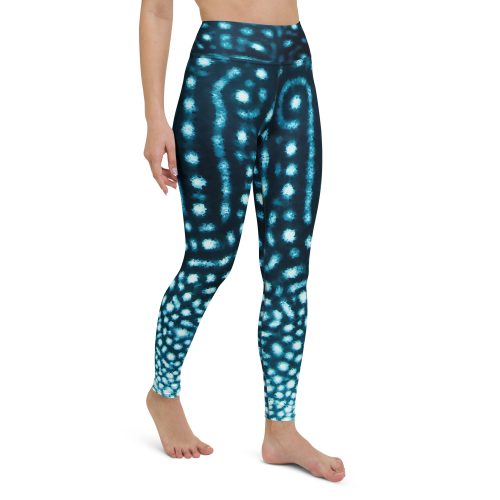 Model walking forward in full-length whale shark print leggings.
